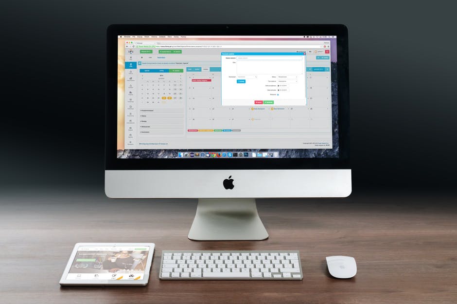 modern workspace featuring an apple imac, wireless keyboard, and elegant design elements.