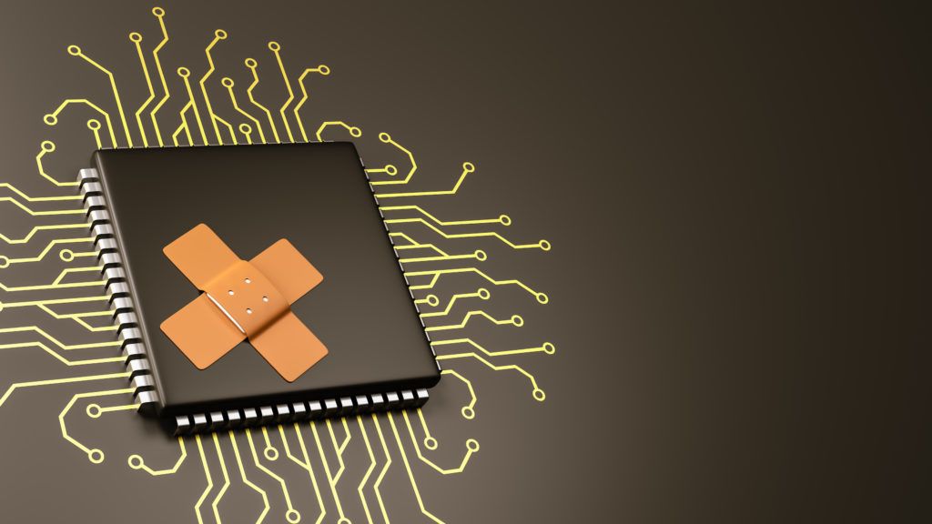 playful cpu chip with band-aids symbolizes technologys fragility against a dark background.