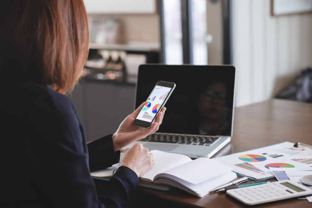 businesswoman leveraging technology to boost productivity in a modern office setting.