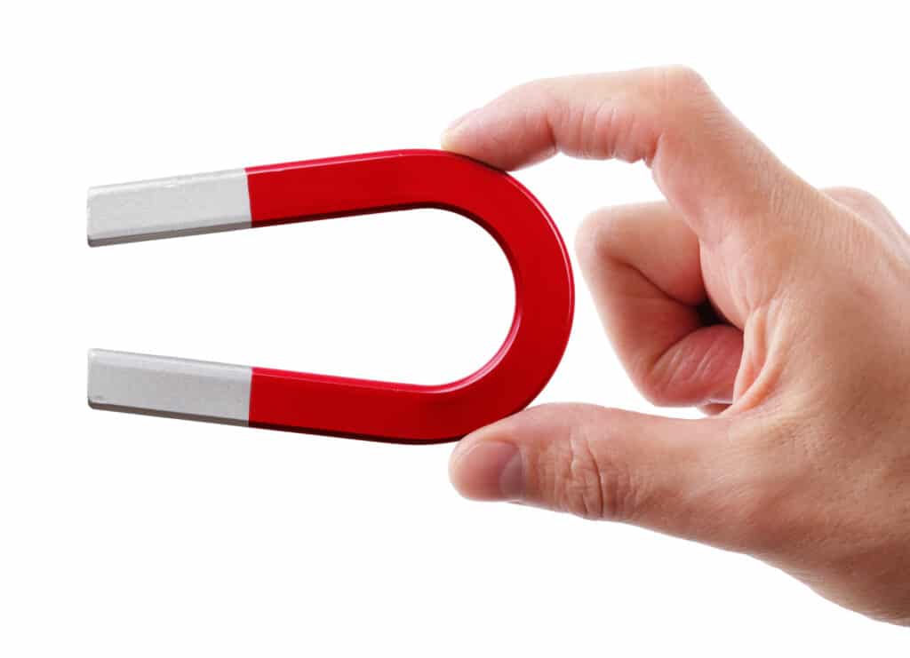 a person holding a pair of scissors in their hand