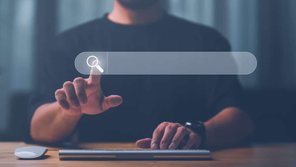 a man is pressing a button on a keyboard